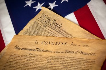 Constitution and Declaration of Independence with a Betsy Ross Flag